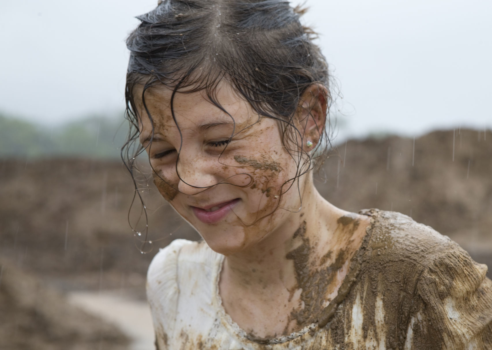 Playing in the mud at a rainy River's Edge